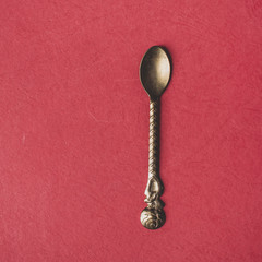 Oriental teaspoon  on a red background 