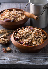 Healthy breakfast of muesli with milk and seeds