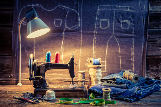 Tailor workshop with sewing machine, cloth and scissors