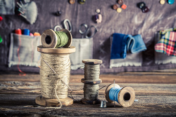 Sewing mat made of buttons, needles and threads in tailor workshop