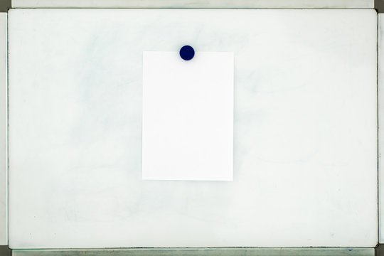 White Sheet Of Paper Attached To The Old Dirty Magnetic Board