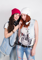 beauty hipster girls with a headphones, teenagers listen to music. disco girls