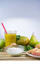 Breakfast with yougurt, green fresh smoothie and fruits and vege