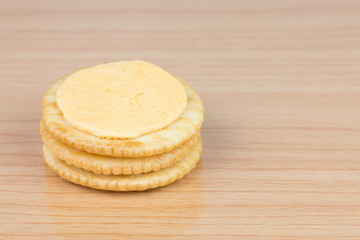 Cracker cream cheese on wooden table