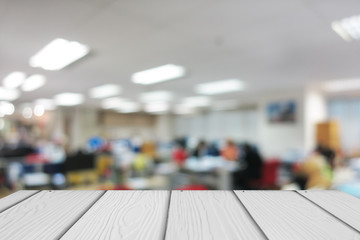 Wooden with abstract blur office background.