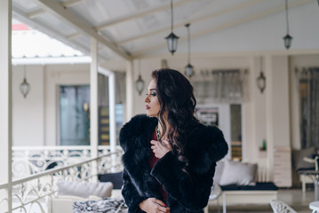 Elegant model in black coat