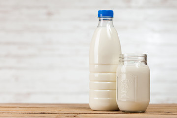 Milk bottle on wooden table