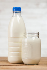 Milk bottle on wooden table