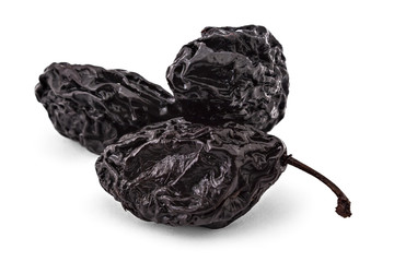 Raw organic prunes, dried plums, isolated on a white background. Closeup