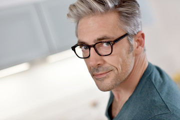 Portrait of handsome mature man with eyeglasses