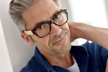 Fototapeta premium Portrait of handsome mature man with eyeglasses
