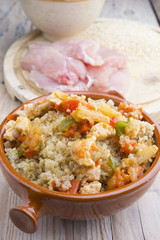 High-key image of white plate with quinoa lentil salad and bowl