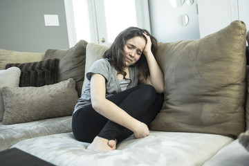 Expression of lonely female teenager at home