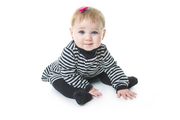 baby sitting on the floor, isolated over white