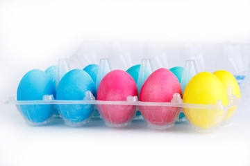 Colorful easter eggs in package isolated.