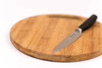 Kitchen knife on the wooden board