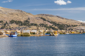 Uros floating island and village on Lake Titicaca near Puno,  Peru