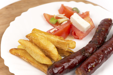 Homemade smoked sausages grilled with potaotes