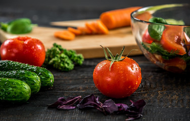 Male hands cutting vegetables for salad