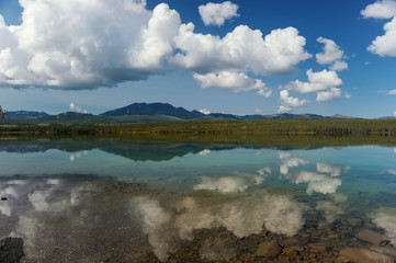 cloudy sky over a lake alaska
