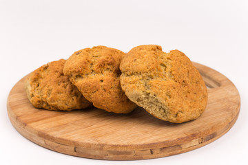 Three bread buns on the cuting board