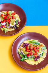 Chicken and Salad Tortilla with Avocado on Orange and Blue Background, Top View, Vertical View