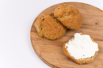 Bread with cream cheese isolated on white background