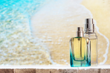 Perfume bottles against sea