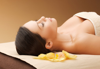 Fototapeta na wymiar woman in spa salon lying on the massage desk