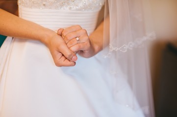 Fototapeta na wymiar bride hands wedding ring