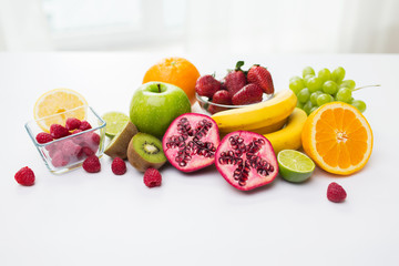 close up of fresh fruits and berries on table