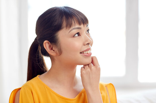 Happy Asian Young Dreaming Woman Face At Home