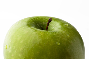 Green fresh ripe apple on white background closeup from side