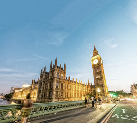 Fototapeta na wymiar Westminster Palace at night with city traffic, London - UK