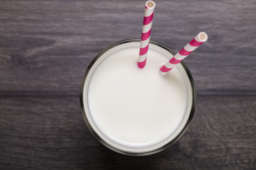Glass of milk on wooden table