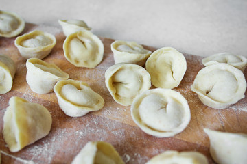 Uncooked dumplings (Pelmeni). Traditional Russian dish