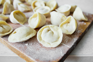 Fototapeta na wymiar Uncooked dumplings (Pelmeni). Traditional Russian dish