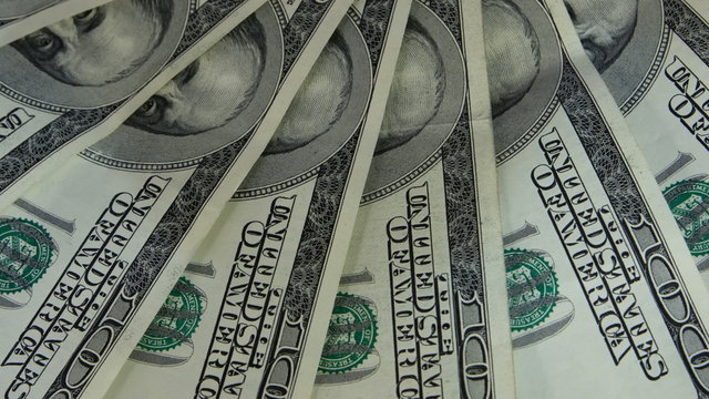 Rotating US dollars banknotes business background. Seamless Looping Motion.