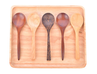 Wooden plate with  spoon isolated on white background