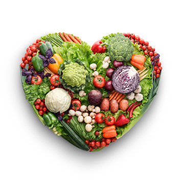 Veggie mix / Healthy food concept of a human heart made of vegetable and fruit mix that reduce death risk, isolated on white.