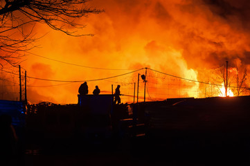 Firefighters battle a blaze