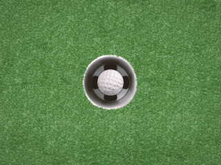 golf ball in golf cup on green