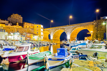 Harbor at Vallon des Auffes with the famous old bridge in Marseille at night, Provence, France
