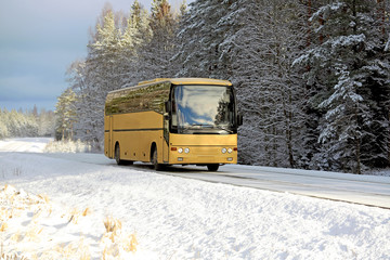 Yellow Bus on Winter Road