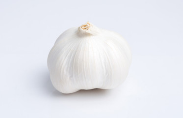 Bulb of garlic isolated on white background with shadow
