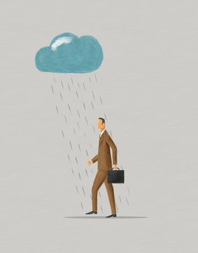 Businessman walking under raincloud.