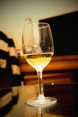 glass of white wine on a table