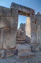 Naklejka premium Stone Gate at Saksaywaman, Saqsaywaman, Sasawaman, Saksawaman, Sacsahuayman, Sasaywaman or Saksaq Waman citadel fortress in Cusco, Peru
