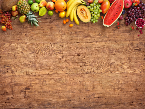 Healthy eating concept. Studio photo of different fruits on old wooden table. High resolution product.