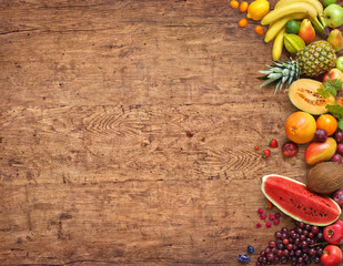 Healthy eating concept. Studio photo of different fruits on old wooden table. High resolution product.